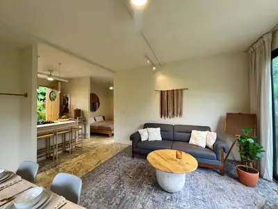 a living room with a couch and a table at Alta Loma in Ojochal