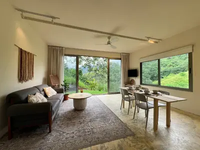 a living room with a couch and a table at Alta Loma in Ojochal