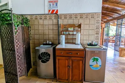 a kitchen with two refrigerators and a counter in a room at Tico Tiki Vacation Villa, 3 Bedroom in Sámara