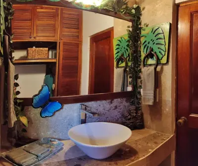 a bathroom with a large white bowl on a counter at Tico Tiki Vacation Villa, 3 Bedroom in Sámara