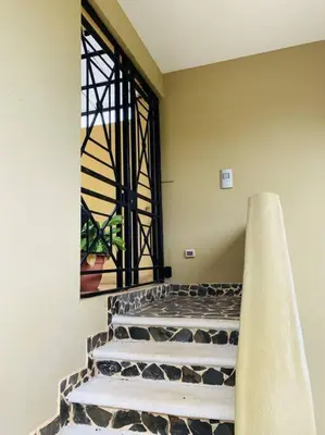 a set of stairs in a room with a window at A6 PL Near the Beach 1bed 1bath private terrace in Tamarindo