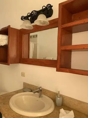 a bathroom with a sink and a mirror at A6 PL Near the Beach 1bed 1bath private terrace in Tamarindo