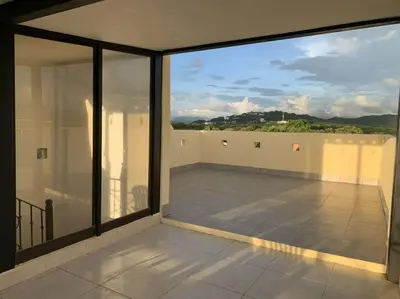 a large balcony with a view of the mountains at A6 PL Near the Beach 1bed 1bath private terrace in Tamarindo