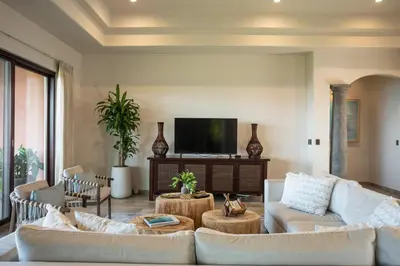 a living room with two couches and a tv at Las Ventanas del Mar-Ridge Condo #13 in Santo Domingo