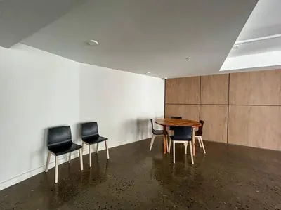 a dining room with a table and four chairs at Ocean Front, Luxurious Condo in Downtown Jaco! in Jacó
