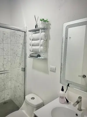 a bathroom with a toilet and a sink and a shower at Cameva Villas - Your perfect escape in Guatemala