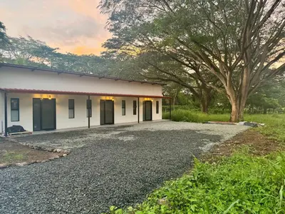 a building with a gravel driveway in front of it at Cameva Villas Your perfect escape in Guatemala