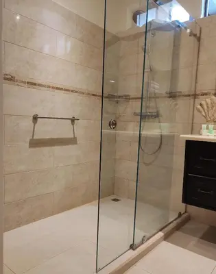 a shower with a glass door in a bathroom at Marenaz Oceanfront Resort in Esterillos Este