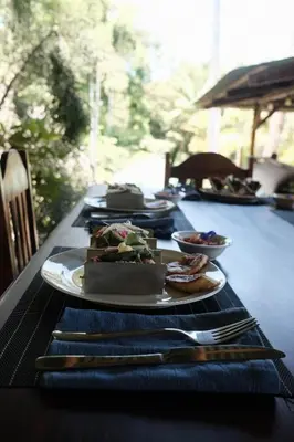a long table with plates of food on it at Finca Bavaria in Ballena
