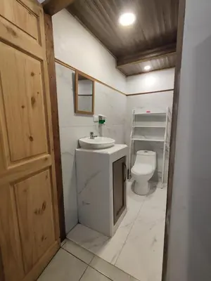 a bathroom with a sink and a toilet at Pura Vida Rentals in Cabuya