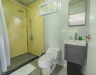 a bathroom with a toilet and a sink and a shower at Dadirri Cozy House Santa Elena Monteverde in Monteverde Costa Rica
