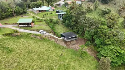 an aerial view of a house on a hill at Dadirri Cozy House Santa Elena Monteverde in Monteverde Costa Rica