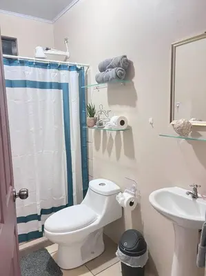 a bathroom with a toilet and a sink at Apartamentos del Sol #2 in Tilarán