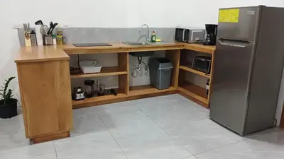 a kitchen with a sink and a refrigerator at Casa Jaspe Monteverde - Balcón vista en Monteverde in Monteverde Costa Rica