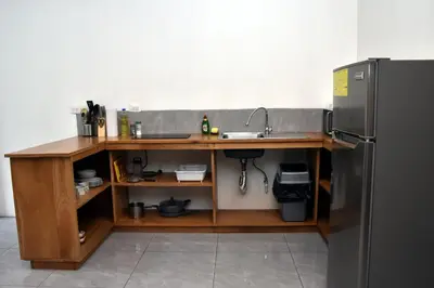 a kitchen with a sink and a refrigerator at Casa Jaspe Monteverde - Balcón vista en Monteverde in Monteverde Costa Rica