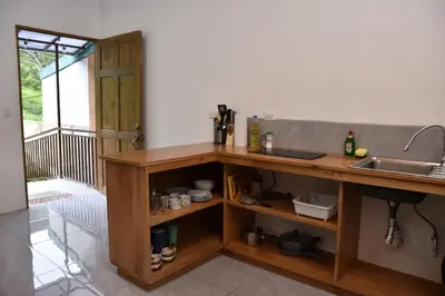 a kitchen with a counter with a sink and a sink at Casa Jaspe Monteverde - Balcón vista en Monteverde in Monteverde Costa Rica