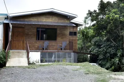 a house with a deck with chairs on it at Casa Jaspe Monteverde - Balcón vista en Monteverde in Monteverde Costa Rica