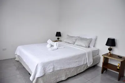 a white bed with two white towels on it at Casa Jaspe Monteverde - Balcón vista en Monteverde in Monteverde Costa Rica