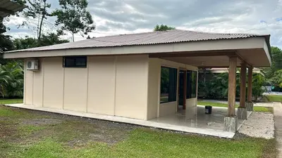a small house with a roof on the grass at Casa anturio 2 in Fortuna