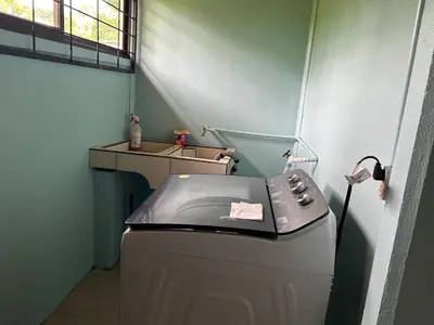 a washing machine in a small room with a window at Casa anturio 2 in Fortuna