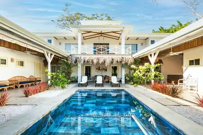 a pool in the backyard of a house at Casa Karibe in Tamarindo