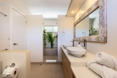 a bathroom with a sink and a mirror at Casa Karibe in Tamarindo