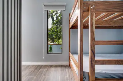 a bedroom with bunk beds and a window at Monte Donato 18 - Apt 1 in Playa Avellana