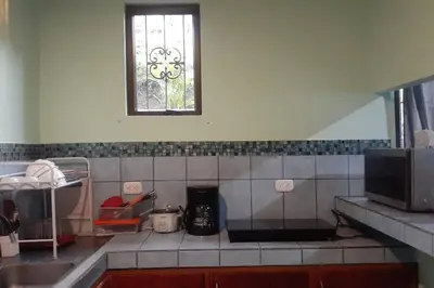a kitchen with a sink and a window at Angel Bee Lodge in Fortuna