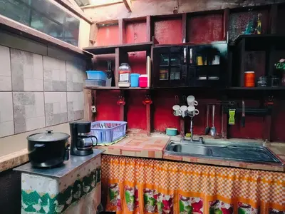 a kitchen with a sink and a counter top at Posada Familiar Rìo Celeste in San Rafael