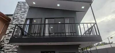 a balcony on the side of a house at APARTAMENTOs HABY 2 in Paquera