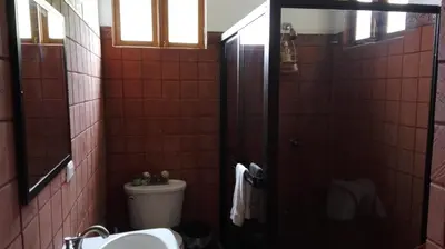 a bathroom with a toilet and a sink at Finca Queveri in Orosí