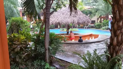 a pool with a fountain in the middle of a resort at Condominio Coco Marindo #34 in Coco