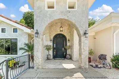 a entrance to a house with a black door at Luxurious 3 Bedroom Villa in Coco