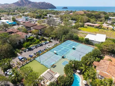 an aerial view of two tennis courts at a resort at Luxurious 3 Bedroom Villa in Coco
