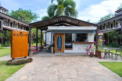 a building with a kiosk in a yard at Luxurious 3 Bedroom Villa in Coco