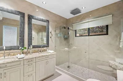 a large bathroom with a shower and a sink at Luxury Retreat Oceanview w Fitness Studio in Playa Hermosa