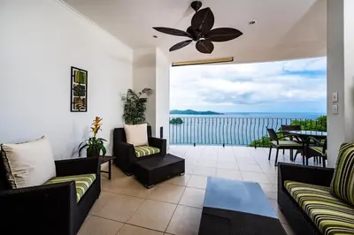 a living room with a view of the ocean at Ocean-Views, Infinity Pools & Private Veranda in Playa Flamingo