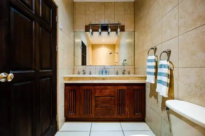 a bathroom with a sink and a mirror at Ocean-Views, Infinity Pools & Private Veranda in Playa Flamingo