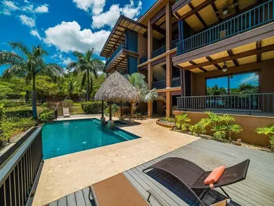 an image of a house with a swimming pool at Spacious Ocean View 3 bd Condo w - Pool in Ocotal