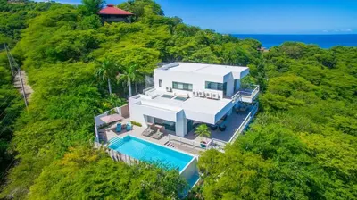 an aerial view of a house with a swimming pool at Ocean-View Villa, Pool & Concierge in Ocotal
