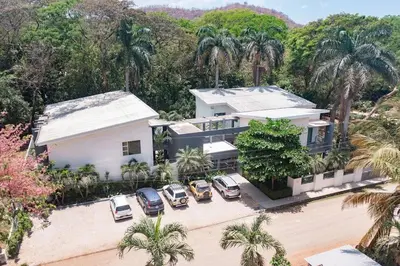 an aerial view of a house with cars parked in front at Garden View, Patio, Steps to Sand with Pool in Potrero