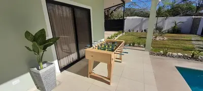 a chess board sitting on the floor of a house at Fun Packed Family Vacation in Playa Flamingo