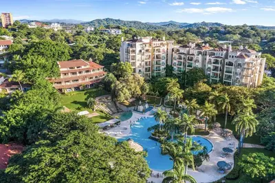 an aerial view of a resort with a water park at Ocean-View Oasis , Swim-Up Bar & Beach Access in Tamarindo