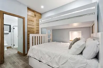 a bedroom with a large white bed in a room at Ocean-View Oasis , Swim-Up Bar & Beach Access in Tamarindo