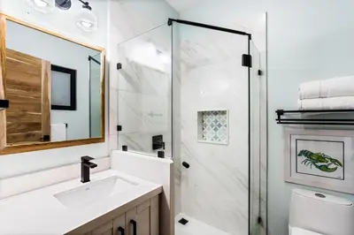 a bathroom with a sink and a shower at Ocean-View Oasis , Swim-Up Bar & Beach Access in Tamarindo