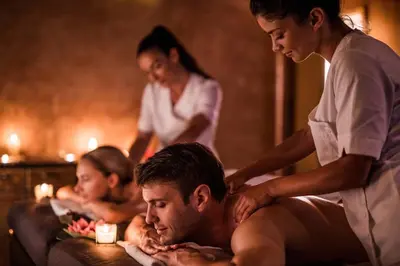 a woman giving a man a massage in a bath room at Buho Vibe Earthy Elegance in Tamarindo