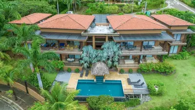 an aerial view of a house with a swimming pool at Hilltop Haven with Pool, Terrace and Sea Breeze in Ocotal