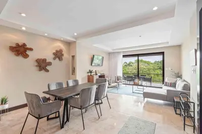 a dining room with a table and chairs at Hilltop Haven with Pool, Terrace and Sea Breeze in Ocotal
