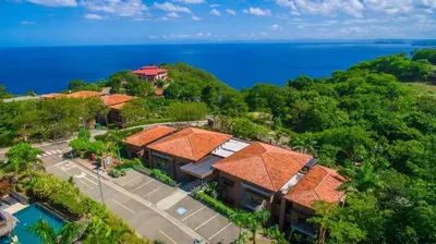 an aerial view of a resort with the ocean at Spacious 4 Bedroom Condo Pool in Ocotal