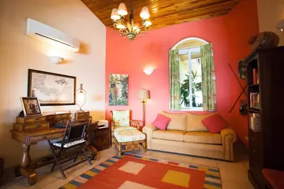 a living room with a couch and a desk at Luxury Villa, Infinity Pool & Ocean Views in Potrero